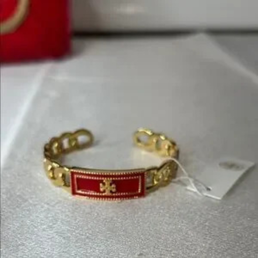 Brand new Tory Burch gold and red bracelet
